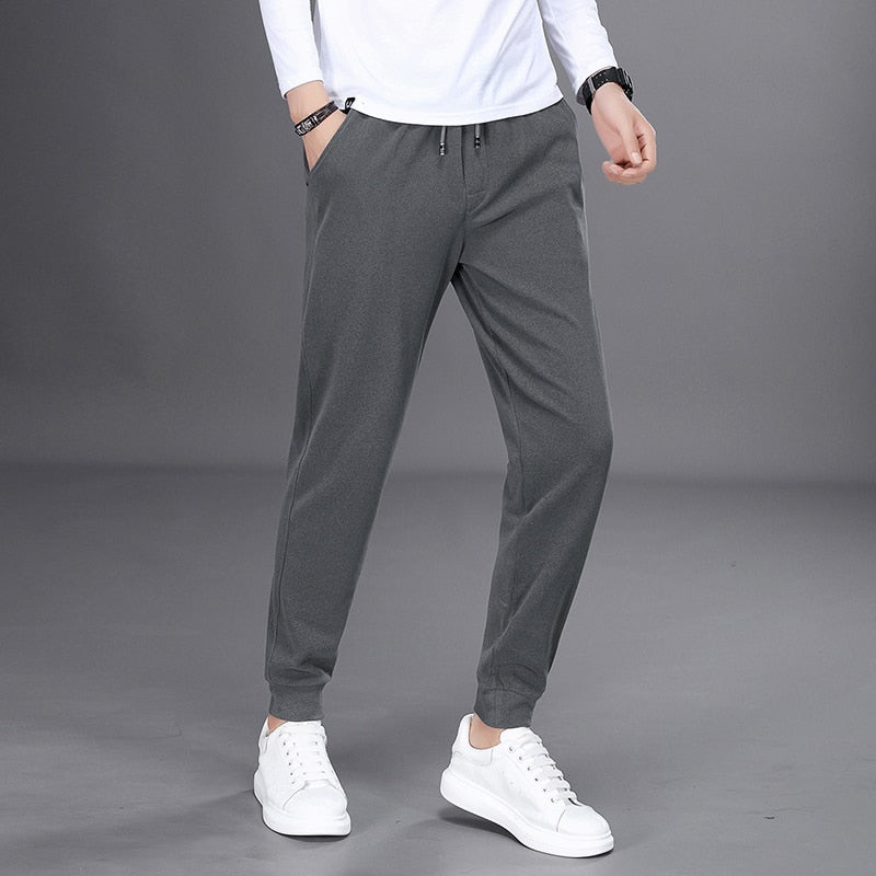 Spring Autumn Black Jogging Pants Men Harajuku Fashion Solid Drawstring Harem Pants Men Long Trousers Elastic Waist Sweatpants